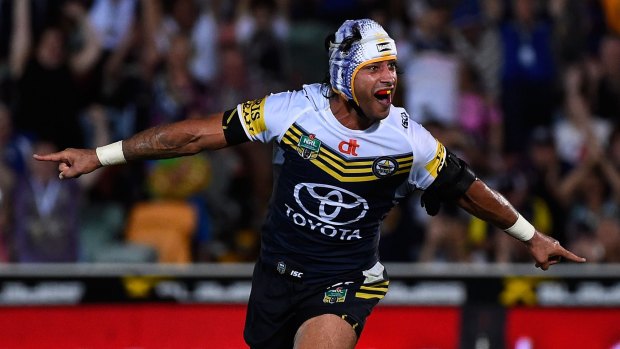 Johnathan Thurston of the Cowboys celebrates after kicking the winning field goal against the Storm on Monday night.