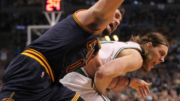 Cleveland Cavaliers forward Kevin Love is dragged by the arm by Boston Celtics center Kelly Olynyk, which resulted in Love's shoulder becoming dislocated.