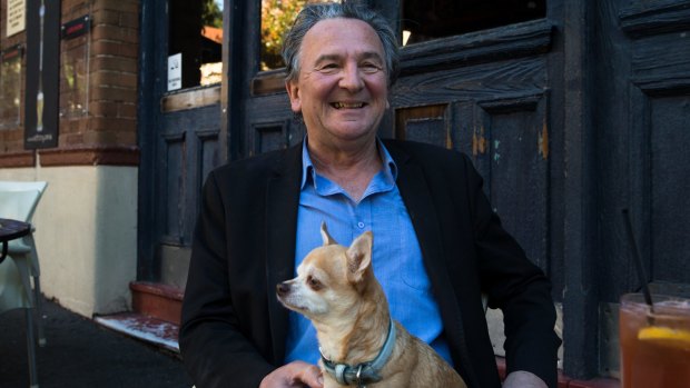 Louis Nowra with one of his dogs, Coco, out the front of the Old Fitzroy Hotel in Woolloomooloo. 