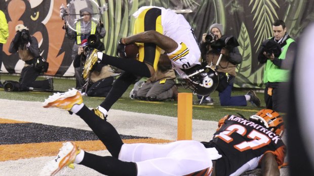 Gravity defying: Martavis Bryant was forced to somersault in the air while securing the ball for a touchdown.