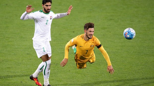 Firing wide: Mathew Leckie's header against Iraq misses the target.