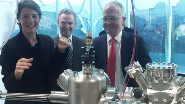Professor Michelle Simmons explains the operation of a new scanning tunnelling microscope to Prime Minister Malcolm Turnbull (right) and the then Minister for Science, Christopher Pyne.