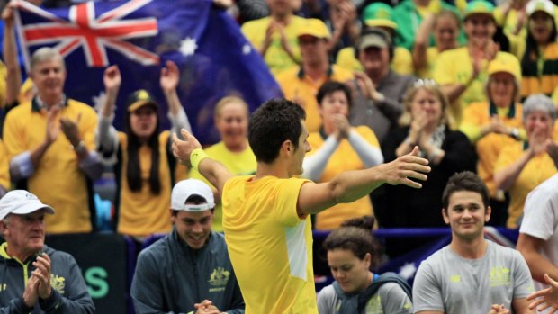 Bernard Tomic savours victory after Australia claim a 3-1 Davis Cup win over Czech Republic in Ostrava.