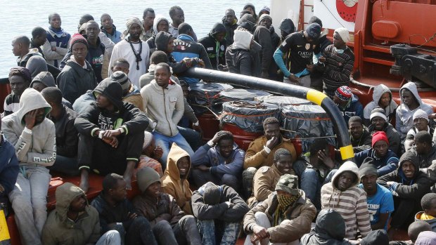 Rescued migrants arrive at the Sicilian harbour of Pozzallo on Sunday.