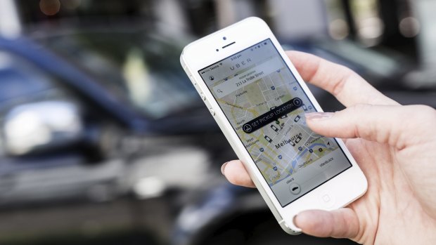 An Uber driver has been bashed with a spanner and had his car stolen, in one of a spate of armed robberies across the south-east.