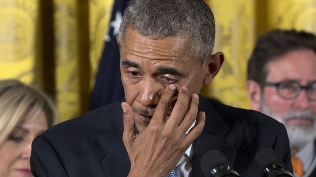President Barack Obama wipes tears from his eyes in January, as he talks about steps his administration is taking to reduce gun violence. 