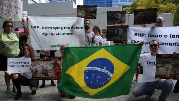 Greenpeace and Get Up activists protest outside the international Annual General Meeting of BHP Billiton in Perth.