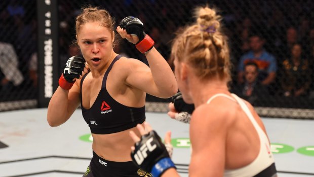 Star power: Ronda Rousey and Holly Holm square off against each other in the first round in their UFC women's bantamweight championship bout during the UFC 193 event at Melbourne's Etihad Stadium on November 15, 2015.