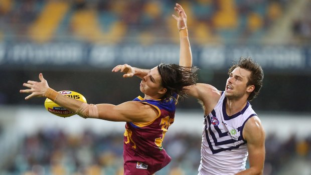 The Lions' Eric Hipwood competes with Fremantle's Joel Hamling.