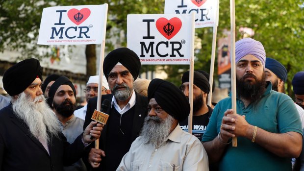 Members of the Manchester Sikh community attend a vigil in Albert Square, Manchester on Tuesday afternoon.
