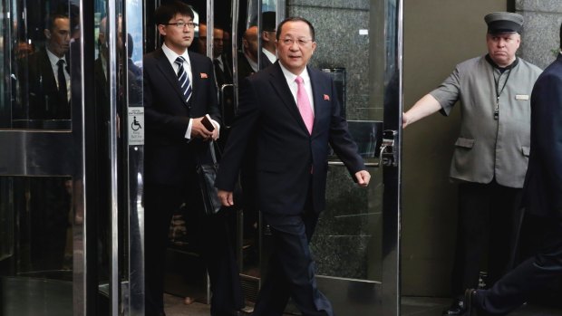 North Korean Foreign Minister Ri Yong-ho, followed by his interpreter, walks to the microphones in New York on Monday to say Donald Trump's remarks amounted to a declaration of war against his country.