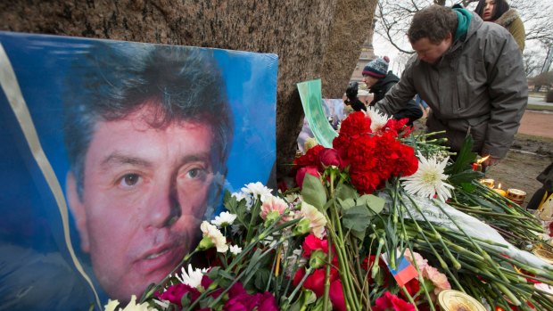People lay flowers in memory of Boris Nemtsov in Moscow.