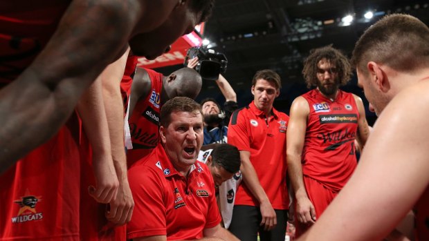 Wild in the west: Perth coach Trevor Gleeson addresses his Wildcats players at a time-out.