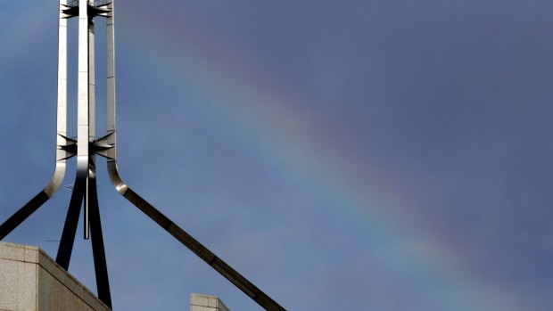 A rainbow forms over Parliament House in Canberra ahead of the Liberal party room meeting.