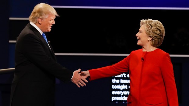 During last year's election campaign then Presidential candidate Donald Trump paradoxically assailed his Democratic opponent  Hillary Clinton for beng too close to Wall Street and Goldman Sachs' former chief Lloyd Blankfein. Pictured shaking hands during the presidential debate at Hofstra University in Hempstead, New York.