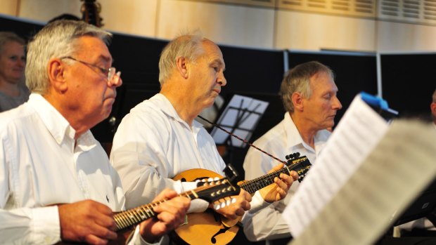 Canberra Mandolin Orchestra members Wal Jurkiewicz, Ian Bull and John Hyam perform at the Belconnen Arts Centre.