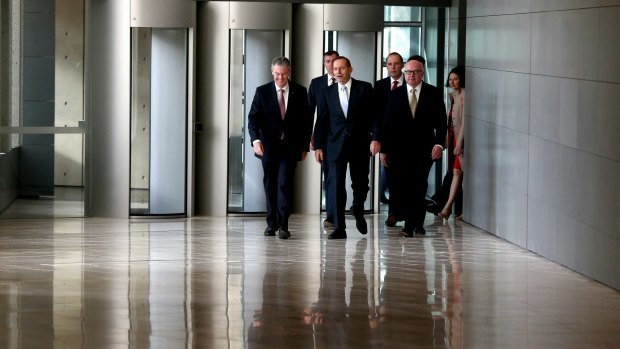 ASIO director-general of security Duncan Lewis, Justice Minister Michael Keenan, Prime Minister Tony Abbott, Immigration Minister Peter Dutton and Attorney-General Senator George Brandis during their visit to the ASIO headquarters in Canberra.
