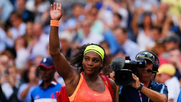 Dejected: Serena Williams walks off the court after losing to Roberta Vinci.