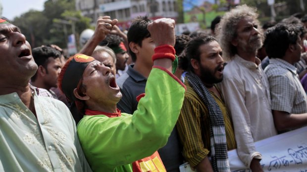 Bangladeshi activists shout slogans at a rally on a half-day nationwide strike in Dhaka on Tuesday, demanding the arrest of the militants who attack  secularist bloggers and publishers. 