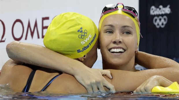 Missing out: Emma McKeon (right) congratulates Sweden's gold medal winner Sarah Sjostrom after the Swede set a world record in the women's 100-metre butterfly final in Rio.