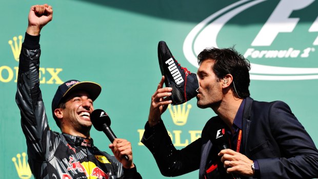 Sparkling success: Mark Webber drinks champagne from Daniel Ricciardo's racing shoe after the Australian driver's second-placed finish in the Belgian Grand Prix.