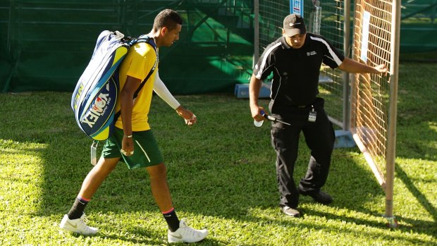Exit: Nick Kyrgios leaves the arena after losing his match against Aleksandr Nedovyesov.