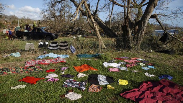 People dry their clothes near the beach at Lenakel town in Tanna, days after Cyclone Pam hit Vanuatu.