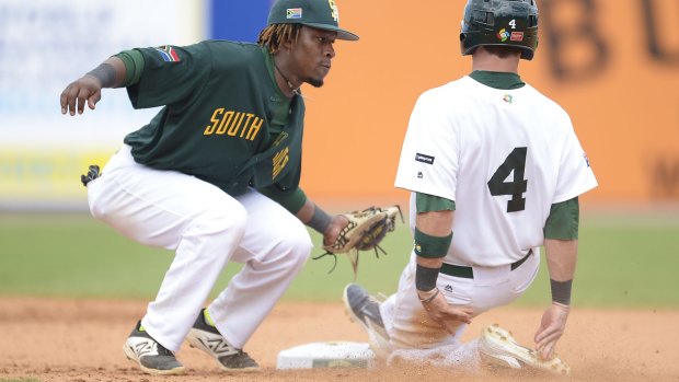 Hitting the skids:  Logan Wade of Australia gets run out on 2nd base by South Africa's Gift Ngoepe.