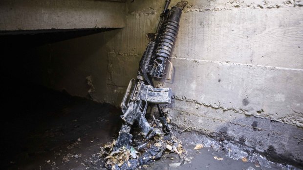 An abandoned weapon is propped against a storm drain wall, in the neighbourhood where special forces had located the world's most-wanted drug lord "El Chapo", Mexico, last month. 