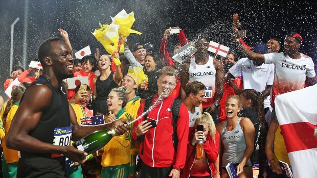 Usain Bolt celebrates with champagne.