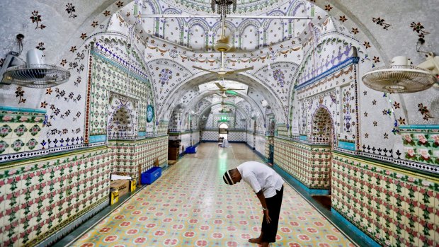 A Bangladeshi Muslim man prays at a Mosque  in Dhaka, Bangladesh.