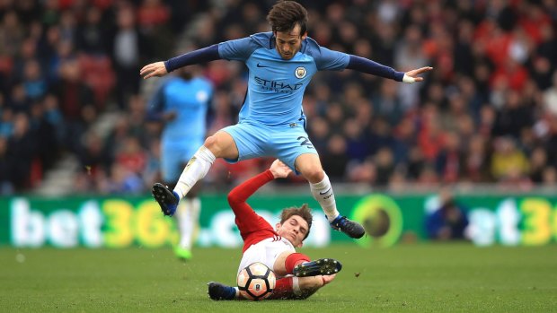 Comfortable: Manchester City's David Silva avoids a challenge from Middlesbrough's Marten de Roon.