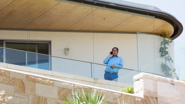 Political donor Huang Xiangmo pictured on the balcony of his house in Mosman.