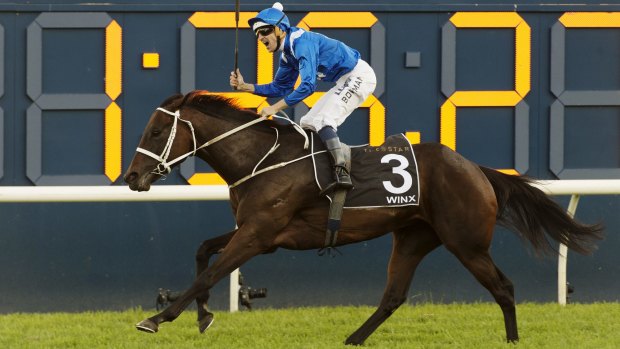 All-conquering: Hugh Bowman comes home in style on Winx.