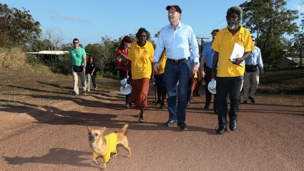 Prime Minister Tony Abbott joins school attendance officers on the walking bus in Yirrkala during his visit to North-East Arnhem Land in 2014.