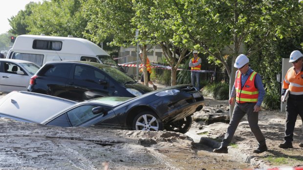 Cars were swallowed by the sinkhole in Port Melbourne on Tuesday. 