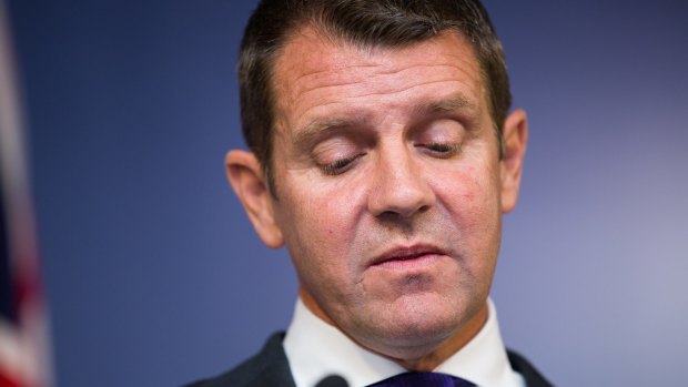 Premier Mike Baird is emotional at a press conference announcing his resignation in Sydney.