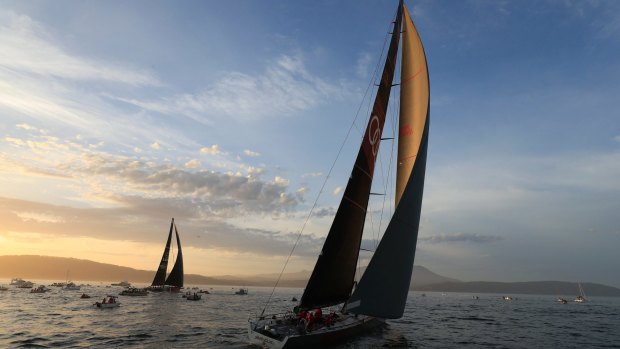 Runner-up Comanche, left, and Sydney to Hobart winner Wild Oats, right, on the River Derwent at the finish on Wednesday night.