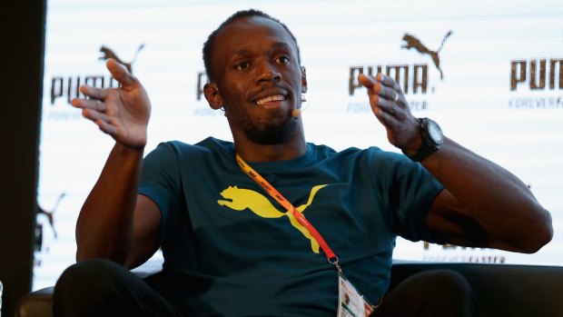 Usain Bolt talks to the media in Beijing on Thursday.
