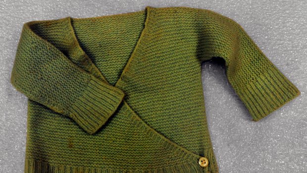 A baby sweater that was left at the Wall in 1990 by the mother of a soldier killed in action. 
