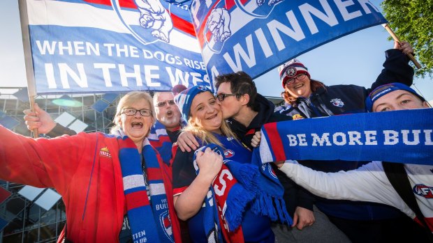 Bulldogs supporters Marilyn, Kym, Nicole, Chris, Danielle and Jack arrive at Whitten Oval after travelling to Sydney by bus to watch the preliminary final.