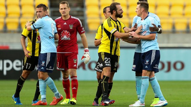 Shane Smeltz exchanges words with Andrew Durante after being shown a red card during the game against the Phoenix.