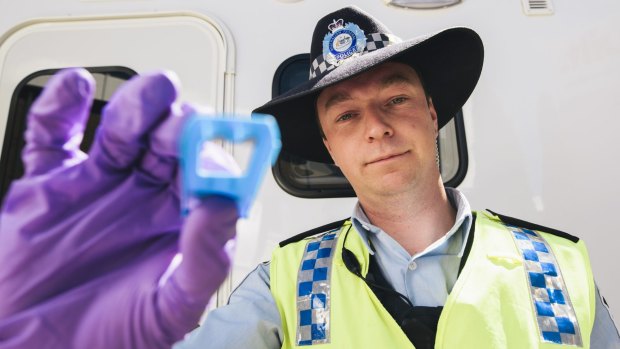 ACT Policing Constable Ashley Knowles with a saliva swab used in random roadside drug tests. 