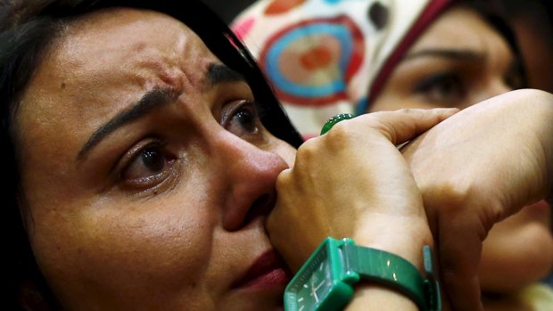 A supporter of Egypt's former dictator Hosni Mubarak, cries during the verdict.