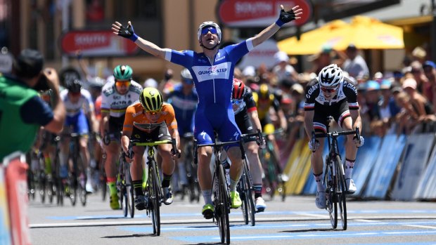 Italian rider Elia Viviani beats home Caleb Ewan (in orange).