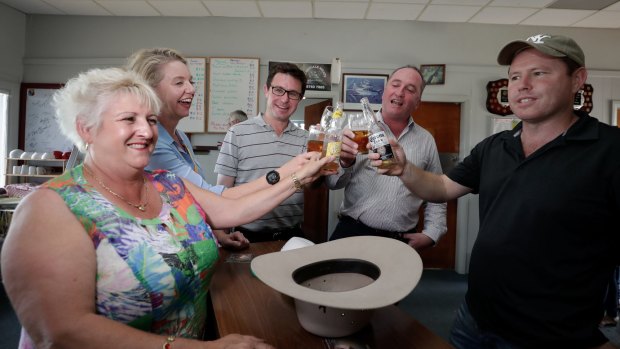 Mr Joyce has a beer while meeting with Nationals colleagues Michelle Landry, Bridget McKenzie, David Littleproud and Andrew Broad at the Aero Club at the Tamworth Airport on Friday.