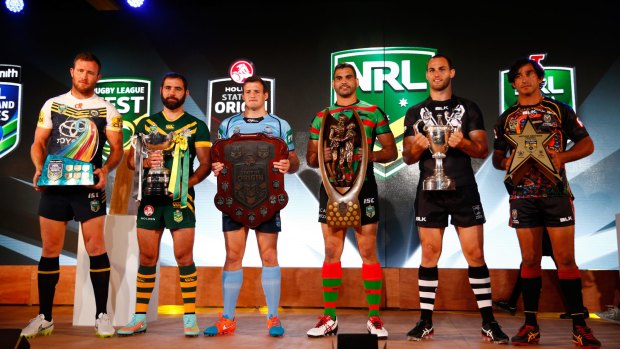 Winners: Gavin Cooper, Cameron Smith, Josh Morris, Greg Inglis, Simon Mannering and Johnathan Thurston hold their respective trophies from the 2014 season. 