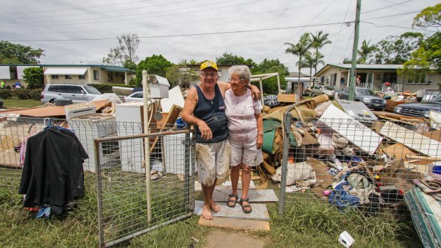 Ken and Joyce England have placed all their damaged furniture and their
belongings on the street at their Tarcoola Street home in East Ipswich