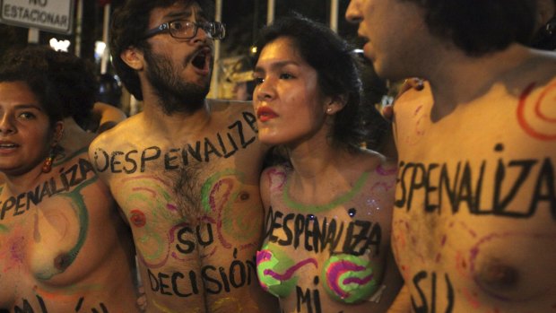 Pro-abortion activists march towards Peru's Congress to support a proposal to change abortion laws.