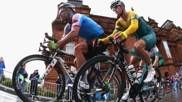 Svein Tuft of Canada and Mark Renshaw of Australia compete during the road race on Sunday.
